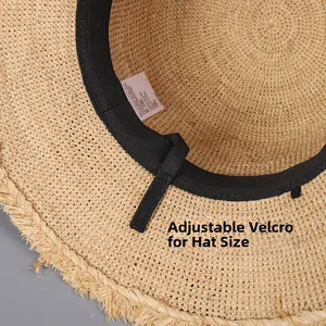Detail of adjustable velcro strap inside straw sun hat for customized head circumference