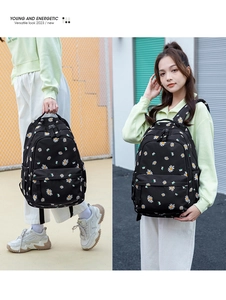 Detail of black backpack with daisy floral print featuring double-screen model display