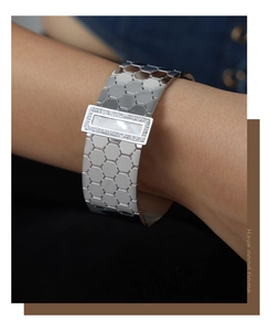 Detail of wide honeycomb hexagonal hollow silver bangle with mother of pearl inlay