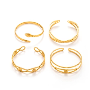 Set of four gold stainless steel snake style open adjustable bracelets for women
