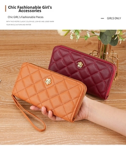 Detail of orange and burgundy quilted wristlet wallets with golden floral metal clasps