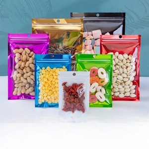 Macro shot of colorful aluminum foil pouches with clear window and secure resealable zipper