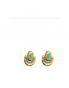 Détails de boucles d'oreilles vintage en or avec zircon vert et pavé de pierres bleues