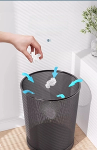 Detail of black wire mesh waste bin with large caliber wide mouth for office