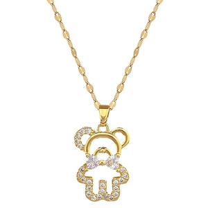 Luxurious gold titanium teddy bear necklace with crystal bowtie and pavé diamonds