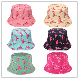 Detail view of double-sided bucket hats with flamingo prints in six vibrant colors
