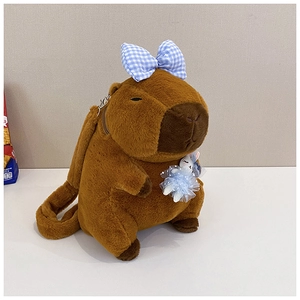 Detailed view of brown Capybara plush backpack with blue plaid bow and small bunny