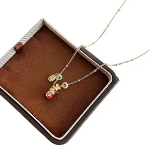 18k gold plated necklace with red lucky money bag pendant and colorful charms