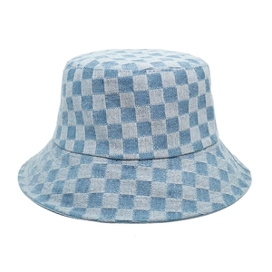 Close-up of blue and grey checkered bucket hat in textured thick woven fabric detail