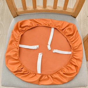 Waterproof orange PU leather chair seat cover with four white elastic straps and buckles