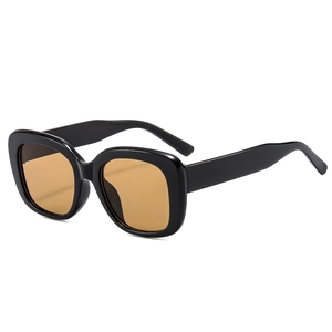 Square oversized sunglasses with thick black frame and transparent amber lenses