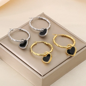 Twisted stainless steel hoop earrings with black heart charms in gold and silver finish