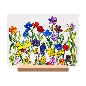 Close-up of vibrant 3D acrylic floral pattern on a natural wood stand tabletop decor