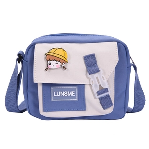 Japanese style nylon crossbody bag in blue and beige with cute cartoon brooch and buckle
