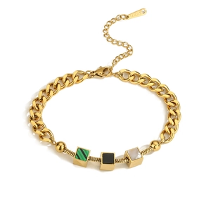 Detail of gold stainless steel Cuban and snake chain with tricolor square beads