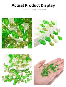 Macro detail of acrylic green leaf charms showing lifelike vein texture and top hole