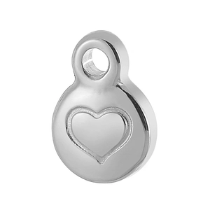 Macro shot of silver round stainless steel pendant with heart embossed pattern and top loop