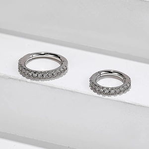 Close-up of S925 sterling silver hoop earrings with shimmering pavé zircon stones