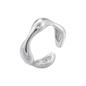 Macro shot of silver liquid metal style ring featuring a polished organic wavy design