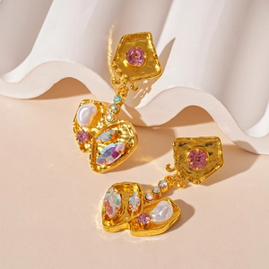 Vintage irregular geometric earrings in gold with pink gemstones and baroque pearls