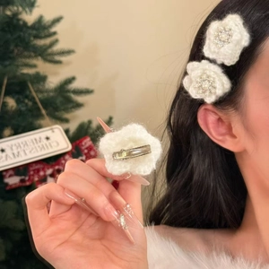 Elegant white knitted flower hair clips with pearls and rhinestones on a metal base