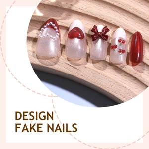 Cat eye red press-on nails with 3D bows, pearls, and heart designs on a wood display