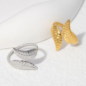 Adjustable leaf open rings in gold and silver finish with detailed vein texture