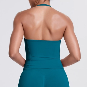 Back view of dark teal seamless halter sports bra and matching high waist leggings set