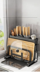 Detail of multi-functional black metal kitchen rack for knives and cutting boards