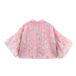 Detail of pink mesh blouse with 3D floral embroidery and voluminous balloon sleeves