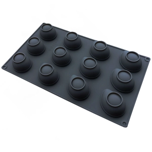 Detailed view of gray 12-cavity silicone mold for baking banana jelly mousse and chocolate