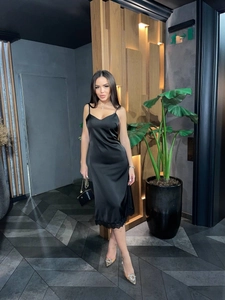 Sexy black satin v-neck midi dress with lace trim and spaghetti straps in a sleek fit
