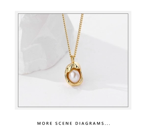 Macro detail of a golden irregular pearl pendant necklace on a stone background