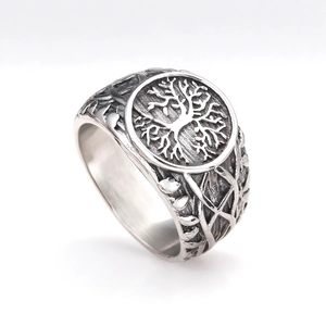 Vintage stainless steel Tree of Life ring with antique silver finish on white background