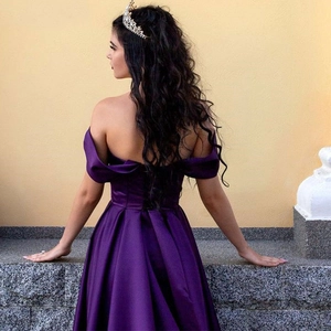 Elegant purple satin off-shoulder evening gown with a flowing A-line skirt back view