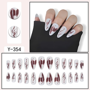 Detail view of water drop almond nails with white and dark red marble smoke texture