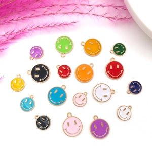 Detailed view of colorful enamel smiley face charms for DIY jewelry making and necklaces