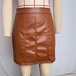 Front detail of high-waist brown PU leather A-line skirt with vertical seam stitching