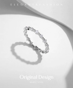 Detailed shot of S925 silver ring featuring geometric round and square sparkling stones