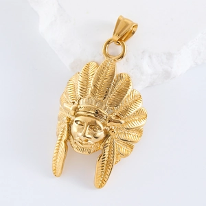 Macro shot of gold lion head pendant with intricate details on a white stone base