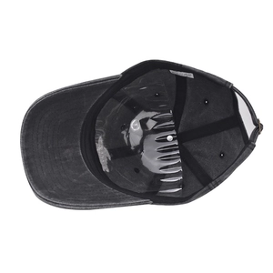 Detail view of washed cotton baseball cap interior with sweatband and quality care label