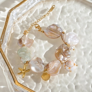 18k gold plated stainless steel bracelet with shell, starfish and pearl charms