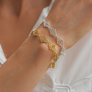 Close-up of vintage hollowed heart and cloud bracelet with adjustable extension chain