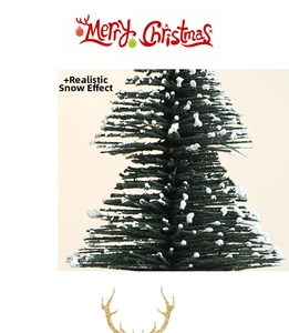 Close-up of mini Christmas tree featuring realistic artificial fallen snow on green needles