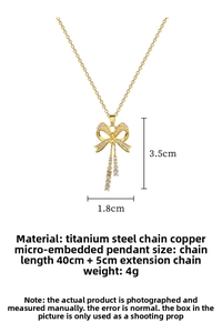 Macro shot showing titanium steel bow necklace with crystals and pearl details