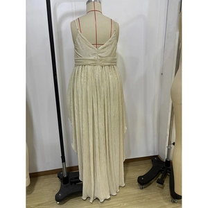 Detail of champagne gold pleated dress with deep V-neck and satin-like reflective texture
