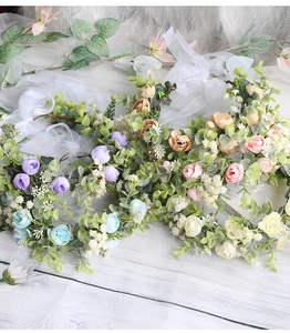 Detail view of artificial flower crowns with roses and eucalyptus for bridal wedding photography