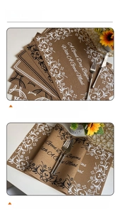 Detail of dark brown Teslin placemat with floral pattern and vintage meal quote