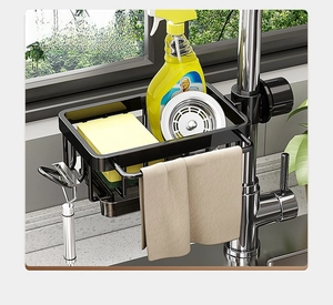 Detail view of black stainless steel faucet storage rack with sponge basket and towel bar