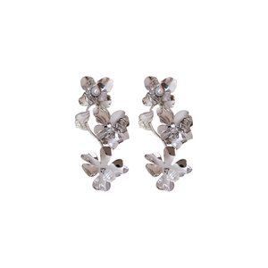 Silver metallic flower earrings with pearl centers in a triple floral drop design